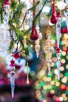 christmas glassy ornaments hanging from a chrismas tree