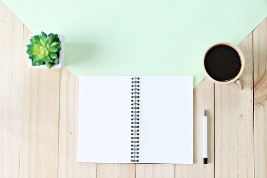 Still life, business, office supplies or education concept : Top view or flat lay of open notebook paper with blank pages and coffee cup on wooden background, ready for adding or mock up