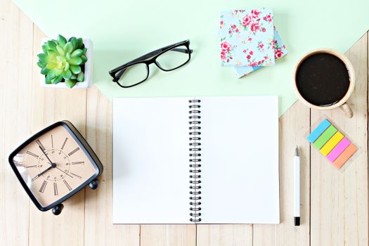 Still life, business, planning or education concept : Office desk table with open notebook paper, accessories and coffee cup, Top view or flat lay with copy space ready for adding or mock up