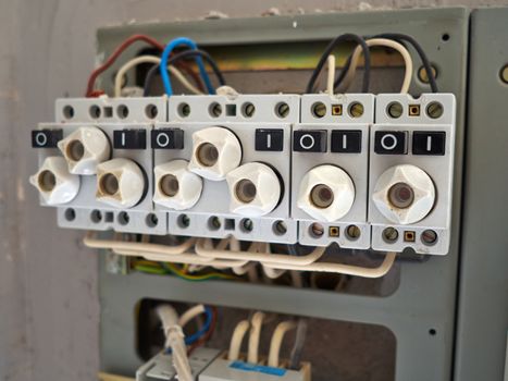 Electrical cabinet with old type fuses with exposed wires ready for upgrade