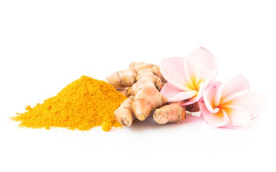 Closeup turmeric powder and turmeric roots on white background for spa skin care beauty concept, selective focus