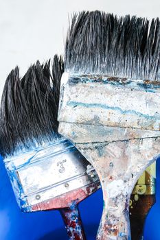 Close up of old paint brushes, grunge and rusty texture background