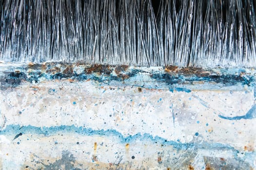 Close up of old paint brushes, grunge and rusty texture background