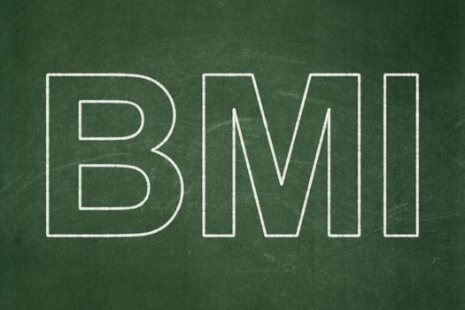 Healthcare concept: text BMI on Green chalkboard background