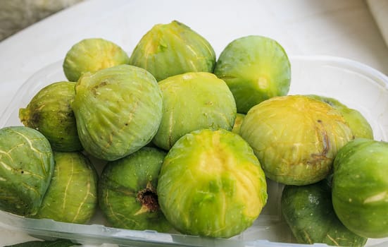 Green fresh figs on a table
