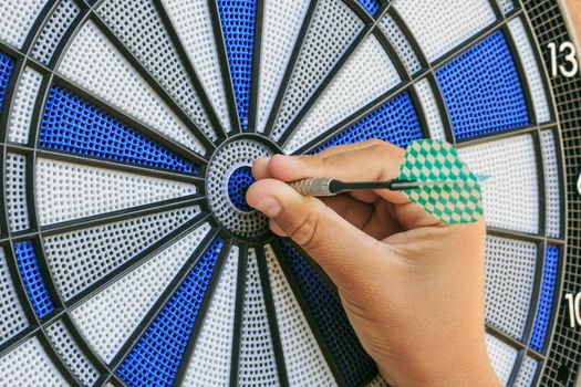 Bullseye on a wall with some darts