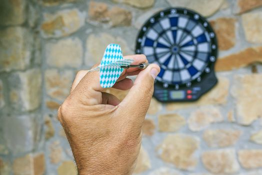 Bullseye on a wall with some darts
