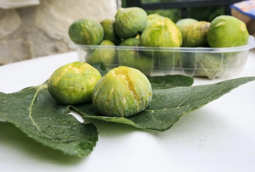 Green fresh figs on a table