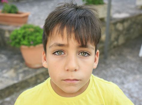 Boy with beautiful green eyes