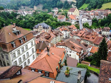 Picturesque cityscape of medieval town Fribourg with its gothic cathedral, old town and ancient fortification, Switzerland, Europe.