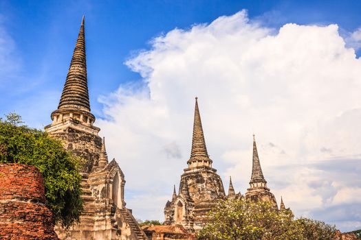 View of asian religious architecture ancient Pagodas in Wat Phra Sri Sanphet Historical Park, Ayuthaya province, Thailand, Southeast Asia. Thailand's top historic landmark, attraction and destination