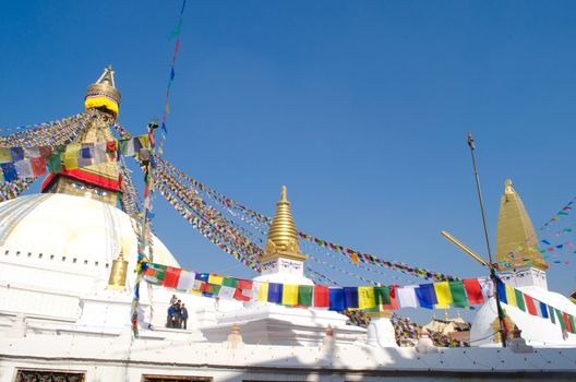 the famous buuha eye gazing out sleepily from each side of the tower are those of the all seeing primordial buddha.perched a top a hill on the western edge of the kathmandu valley.