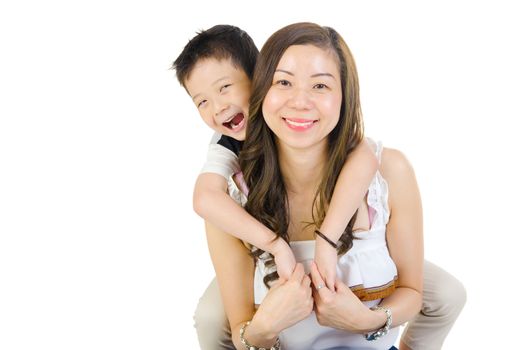 Indoor portrait of asian child hug her mother isolated on white background