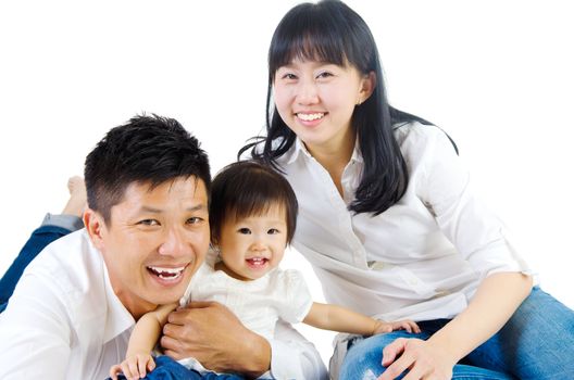 Portrait of a happy asian family in the studio