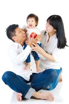 Portrait of a happy asian family in the studio