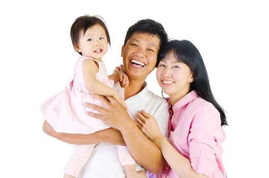 Portrait of a happy asian family in the studio