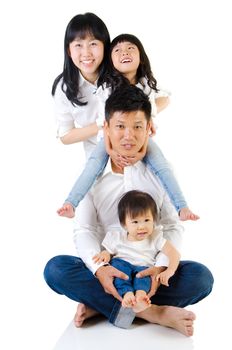 Portrait of a happy asian family in the studio