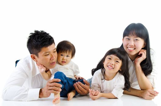 Indoor portrait of asian family in the studio