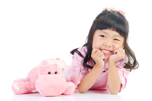 Portrait of a lovely asian girl lying on the floor