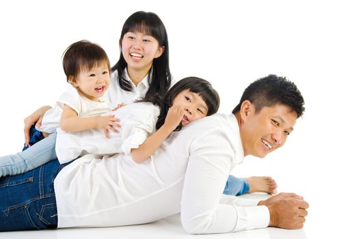 Portrait of a happy asian family in the studio