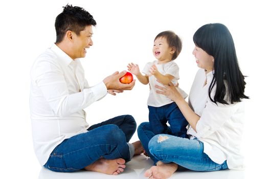 Portrait of a happy asian family in the studio