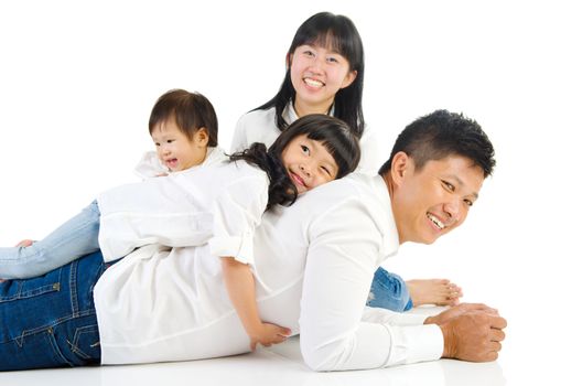 Portrait of a happy asian family in the studio