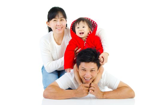 Portrait of a happy asian family in the studio