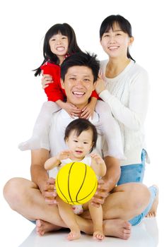 Portrait of a happy asian family in the studio