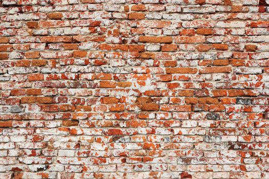 detail of real textural damaged red brick wall ready for your architectural design