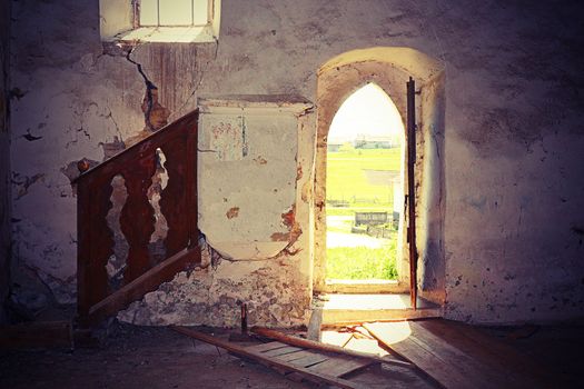 interior of abandoned old gothic church, damage on walls