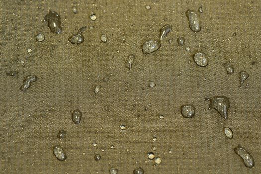 detail of water repellent green material with drops