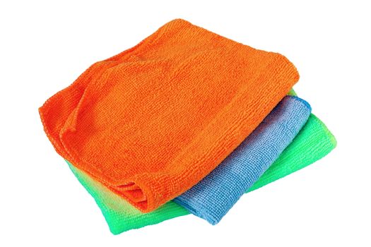 stack of three towels isolated over white background 
 ( orange, blue, green )