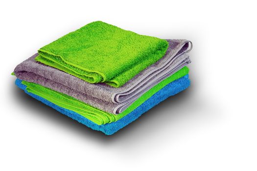 pile of colorful towel on white background with shadow