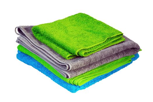 stack of colorful towels isolated over white background ( green, blue, gray )