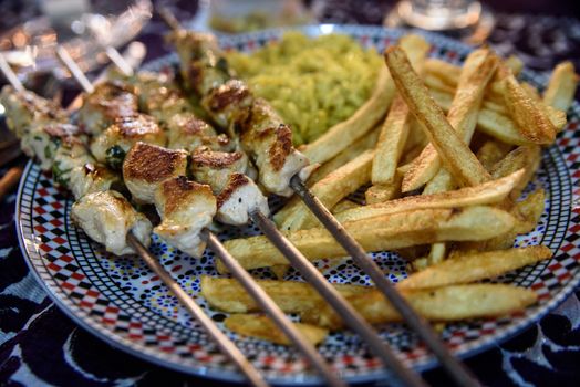 Moroccan shashlik kebab with french fries.