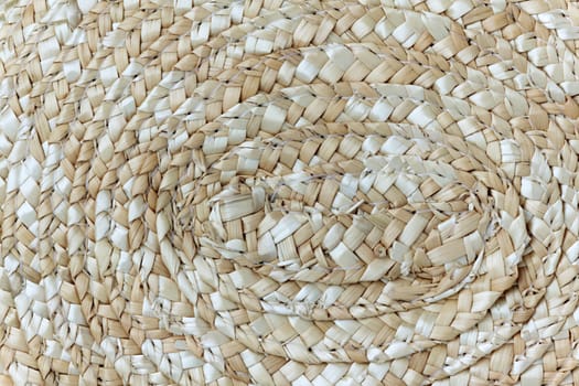Background of a straw hat, close-up.