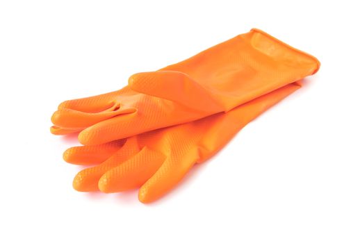 Orange color rubber gloves for cleaning on white background, housework concept