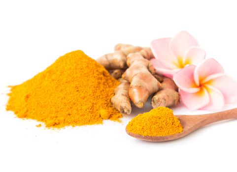 Closeup turmeric powder and turmeric roots on white background for spa skin care beauty concept