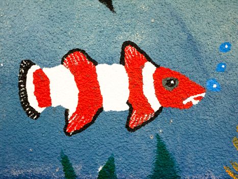 a painted fish on the wall up close with bubbles; England; UK