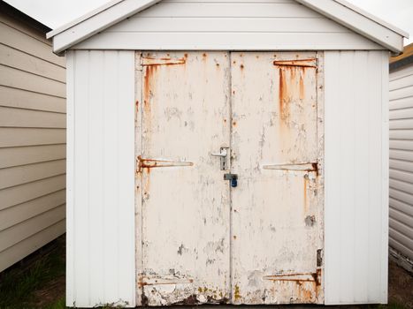 close up of shed door white rusted grunge dirty; England; UK