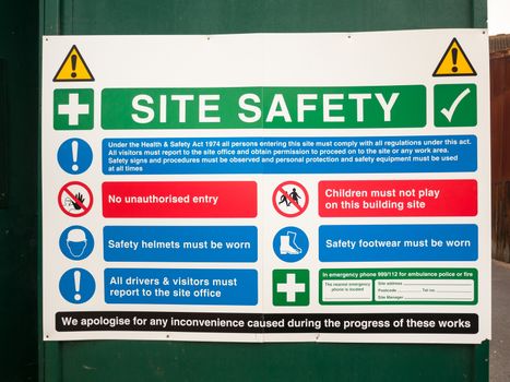 close up of site safety sign on green wall; England; UK