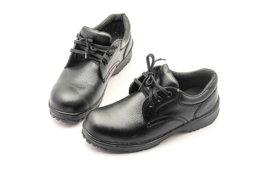 Protective workwear black safety shoes on white background.