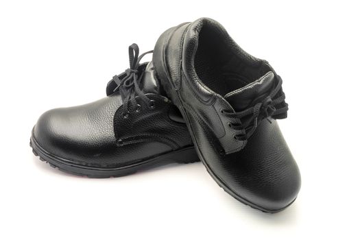 Protective workwear black safety shoes on white background.