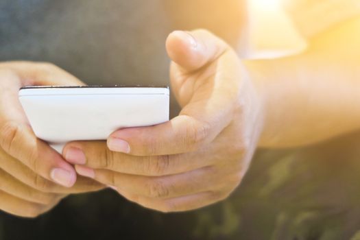 close up of hand typing on phone