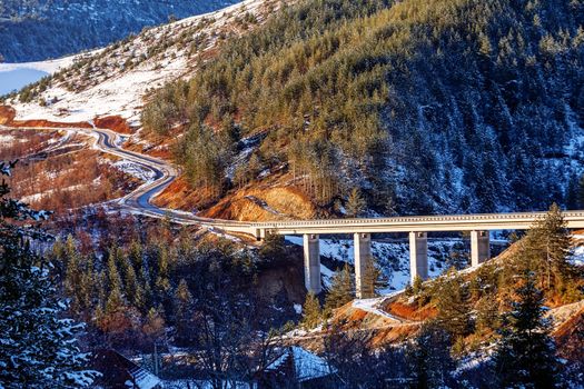 Mountain bridge in winter with snow and blue sky, Zlatibor mountain, Serbia