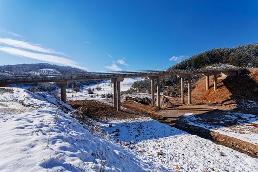 Mountain bridge in winter with snow and blue sky, Zlatibor mountain, Serbia