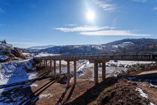 Mountain bridge in winter with snow and blue sky, Zlatibor mountain, Serbia