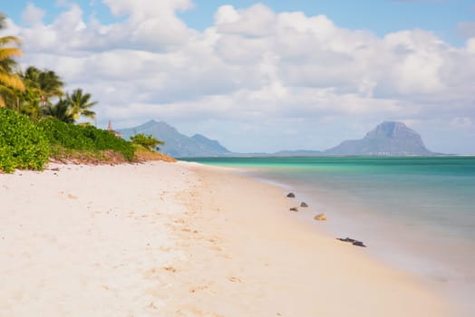 Relaxing on remote Paradise beach,typical tropical beach at Mauritius island.