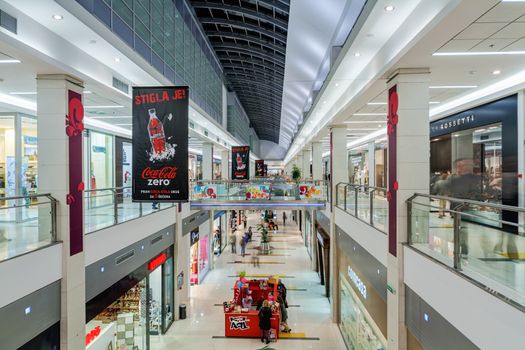 Interior of shopping mall with people walking