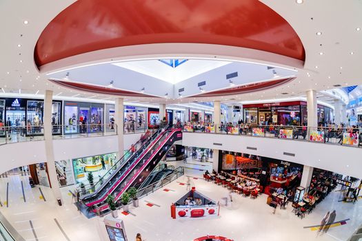 Interior of shopping mall with people walking